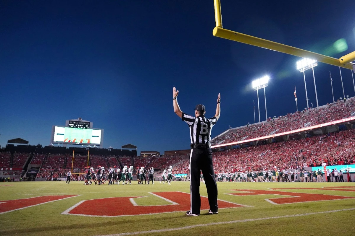 football official indicates touchdown full stadium